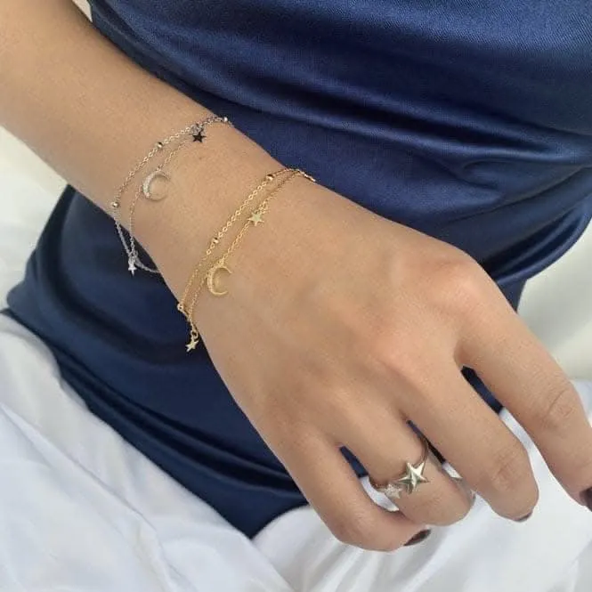 Sterling Silver Rhodium Plated Moon And Stars Charm Bracelet ERLB019 Ania Haie Jewellery